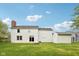 A view of a home's well-kept exterior, backyard, and firepit at 5 Statesman Ct, Brownsburg, IN 46112