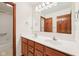 Bathroom vanity with double sink and traditional wood cabinets at 5 Statesman Ct, Brownsburg, IN 46112