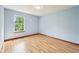 Bedroom features hardwood floors and a window at 5 Statesman Ct, Brownsburg, IN 46112