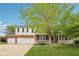 Charming two-story home with brick accents, white siding, covered porch, and a well-manicured front lawn at 5 Statesman Ct, Brownsburg, IN 46112