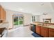 Open-concept kitchen with sliding glass door to the backyard at 5 Statesman Ct, Brownsburg, IN 46112