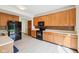 Well-lit kitchen features lots of storage space, and modern black appliances at 5 Statesman Ct, Brownsburg, IN 46112