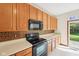 Bright kitchen with plenty of cabinet space and stylish backsplash at 5 Statesman Ct, Brownsburg, IN 46112