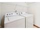 Laundry room with washer and dryer units and storage shelf at 5 Statesman Ct, Brownsburg, IN 46112