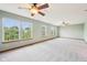 Spacious main bedroom featuring a ceiling fan and oversized windows at 5 Statesman Ct, Brownsburg, IN 46112