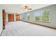 Large main bedroom with carpet and big windows providing backyard views at 5 Statesman Ct, Brownsburg, IN 46112
