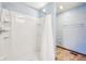 Shower with white tile and curtain at 5 Statesman Ct, Brownsburg, IN 46112