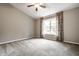 Spacious bedroom with neutral carpet and a ceiling fan, offering comfort and style at 5204 Whipple Wood Ct, Indianapolis, IN 46226