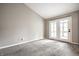 Comfortable bedroom featuring a neutral color palette and bright, glass-paneled doors at 5204 Whipple Wood Ct, Indianapolis, IN 46226