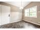 Inviting dining room filled with natural light through large windows and modern flooring at 5204 Whipple Wood Ct, Indianapolis, IN 46226