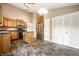 Bright kitchen features stainless steel appliances, wood cabinets, island, and neutral countertops at 5204 Whipple Wood Ct, Indianapolis, IN 46226