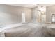 Large living room with vaulted ceilings and plush carpeting features neutral decor, ample natural light, and recessed lights at 5204 Whipple Wood Ct, Indianapolis, IN 46226