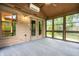 The sunroom features multiple windows, a ceiling fan, and access to the outdoors at 5204 Whipple Wood Ct, Indianapolis, IN 46226