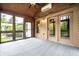 The sunroom features multiple windows, a ceiling fan, and access to the outdoors at 5204 Whipple Wood Ct, Indianapolis, IN 46226
