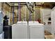 Basement laundry area with new Samsung washer and dryer, utility sink, and easy access to water lines at 5386 W 1100 N, Fountaintown, IN 46130