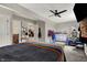 The bedroom boasts neutral paint, a ceiling fan, and large bed to relax in, plus plenty of extra space at 5386 W 1100 N, Fountaintown, IN 46130
