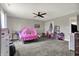 bedroom featuring neutral walls, carpeted floors, a ceiling fan and lots of space at 5386 W 1100 N, Fountaintown, IN 46130