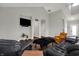 Living room with hardwood floors, modern TV and furniture, and neutral walls at 5386 W 1100 N, Fountaintown, IN 46130