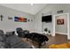 Cozy living room featuring a vaulted ceiling, dark wood-look floors, and stylish decor at 5386 W 1100 N, Fountaintown, IN 46130