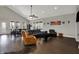 Cozy living room featuring hardwood floors, ample seating, and large windows for natural light at 5386 W 1100 N, Fountaintown, IN 46130