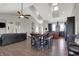 Open-concept living space with view of the kitchen, dining area, and staircase to the upper level at 5386 W 1100 N, Fountaintown, IN 46130