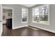 Inviting room with light gray walls, dark floors and two bright windows overlooking the outdoors at 5386 W 1100 N, Fountaintown, IN 46130