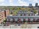 An aerial shot showcasing stylish townhomes in an urban setting, complete with city skyline views and well-maintained surroundings at 548 Lockerbie N Cir, Indianapolis, IN 46202