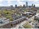 Panoramic aerial view of a residential neighborhood with downtown city skyline in the distance at 548 Lockerbie N Cir, Indianapolis, IN 46202
