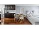 Elegant dining area features hardwood floors, a modern table, and seating, ideal for Gathering meals and dinner parties at 548 Lockerbie N Cir, Indianapolis, IN 46202