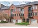 Brick townhomes with private garages and balconies offer an inviting curb appeal at 548 Lockerbie N Cir, Indianapolis, IN 46202