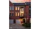 Attractive brick townhome with a private balcony and well-manicured landscaping at 548 Lockerbie N Cir, Indianapolis, IN 46202