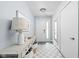 Hallway with a white door and checkerboard rug at 548 Lockerbie N Cir, Indianapolis, IN 46202