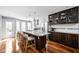 Modern kitchen with a large island, granite countertops, stainless steel appliances, and ample cabinet space at 548 Lockerbie N Cir, Indianapolis, IN 46202