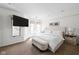 Bright and airy main bedroom with a comfortable bed, bench, and multiple windows, creating a relaxing retreat at 548 Lockerbie N Cir, Indianapolis, IN 46202