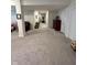 Long view of a finished basement with a variety of recreational and living spaces at 5601 Harness Dr, Greenwood, IN 46143