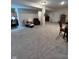 Large basement with a living area and recreational space, ideal for relaxing and entertaining at 5601 Harness Dr, Greenwood, IN 46143
