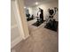 Home gym featuring exercise equipment including weight machines and an elliptical trainer at 5601 Harness Dr, Greenwood, IN 46143
