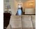 Hallway leading to the home's entry showcasing a lovely chandelier at 5601 Harness Dr, Greenwood, IN 46143