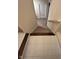 View of the staircase featuring carpeted steps and tile flooring at the bottom at 5601 Harness Dr, Greenwood, IN 46143