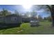 Backyard with green grass and view of house and an above ground propane tank at 5831 Aho Dr, Avon, IN 46123