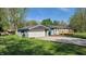 Charming single-story home with light gray siding, a new garage, and a small front yard at 5831 Aho Dr, Avon, IN 46123