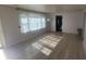 Bright living room with wood floors and a large window at 5831 Aho Dr, Avon, IN 46123