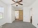 Cozy bedroom with modern ceiling fan and an accessible bathroom with a barn door at 600 S Vine St, Muncie, IN 47302