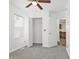 Bright bedroom features plush carpet, a ceiling fan, closet, and a window for natural light at 600 S Vine St, Muncie, IN 47302