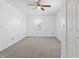 Bright bedroom with neutral carpet, a ceiling fan, and a view of the outside at 600 S Vine St, Muncie, IN 47302