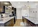 Well-equipped kitchen featuring granite countertops, stainless steel appliances, and stylish fixtures at 622 E 10Th St # 312, Indianapolis, IN 46202