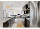 Open concept kitchen flowing into living area with stainless appliances and granite countertops at 622 E 10Th St # 312, Indianapolis, IN 46202