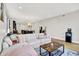 Spacious living area with a large sofa, coffee table, and views into the kitchen at 622 E 10Th St # 312, Indianapolis, IN 46202