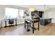 Living space featuring hardwood floors, modern fixtures, and an open layout at 622 E 10Th St # 312, Indianapolis, IN 46202