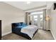 Relaxing main bedroom with balcony access, cozy carpeting, and a comfortable bed at 622 E 10Th St # 312, Indianapolis, IN 46202